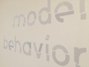 various minimal typographic characters on a wall