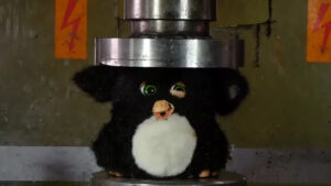Furby in hydraulic press